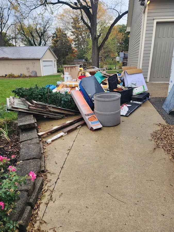 Dumpster being loaded with debris for Commercial Dumpster Rental in Rainbow Springs